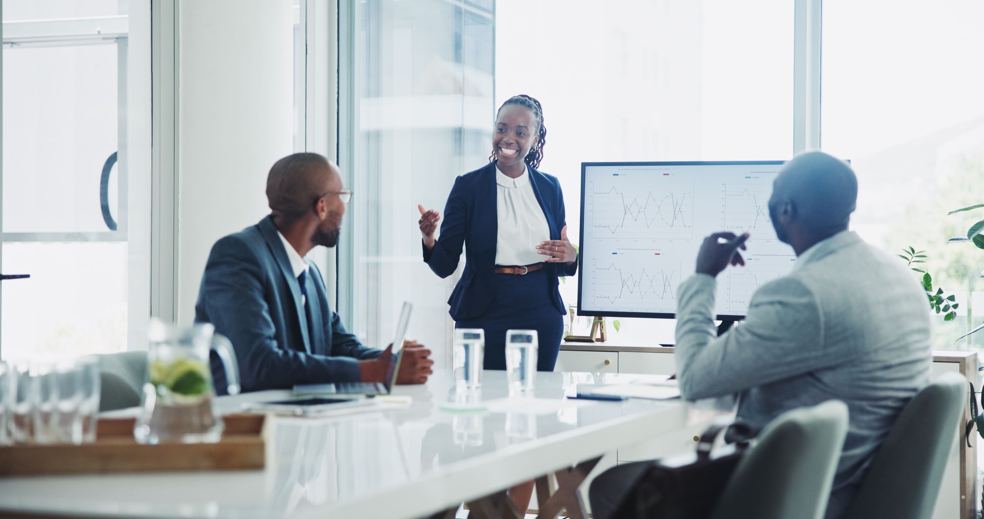 Business, people and presentation in office on meeting and workshop as accountant. Teamwork, collaboration and happy or smile with feedback, review and target report or company growth and client